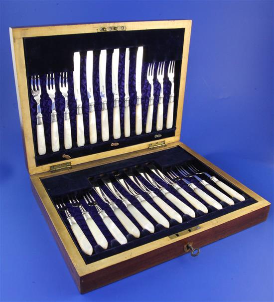 Twelve pairs of late Victorian mother of pearl handled silver dessert eaters, 12.5in.